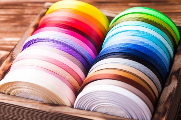 Ribbon bobbins in box — Stock Photo, Image