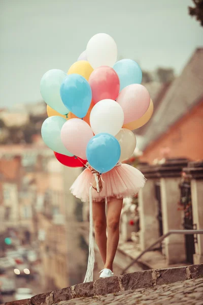 Girl with colorful latex balloons — Stock Photo, Image
