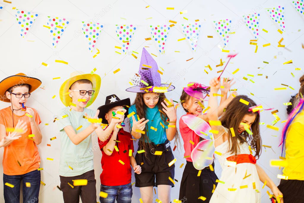 Kids Birthday party with party horns and confetti
