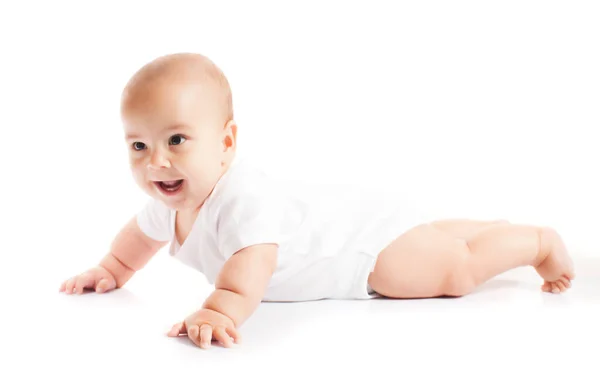 Baby mit ersten Zähnen liegt auf dem Bauch — Stockfoto