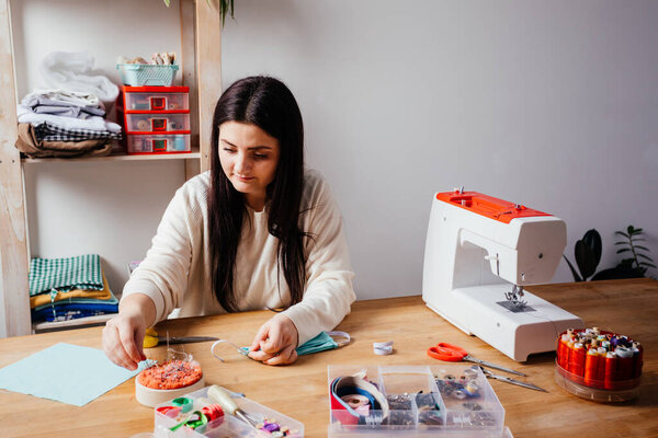 The final stage of medical mask sewing