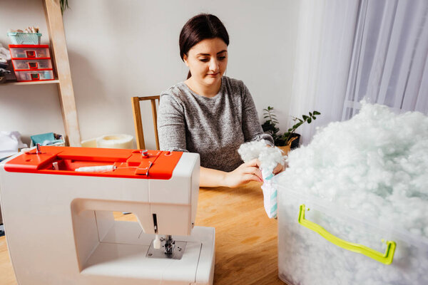 Process of handmade toys stuffing with fluffy hollofiber