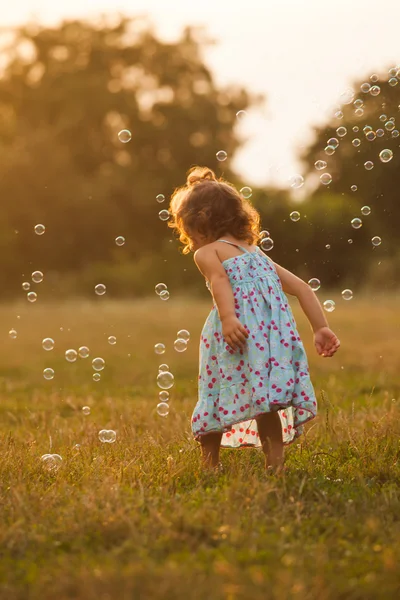 Girl and bubbles — Stock Photo, Image