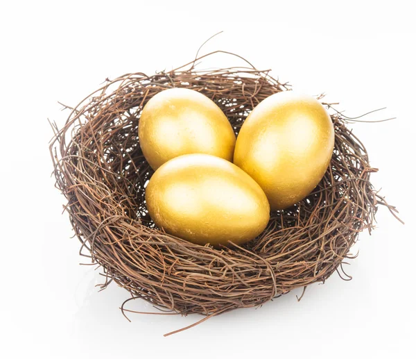 Golden eggs in nest — Stock Photo, Image