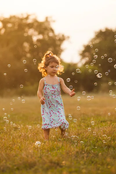 Girl and bubbles — Stock Photo, Image