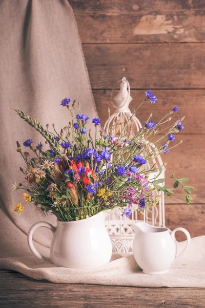 Wildflowers in jug — Stock Photo, Image