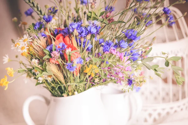 Wildflowers in jug — Stock Photo, Image