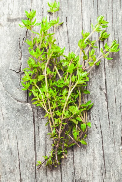 Thyme on the wooden table — Stock Photo, Image