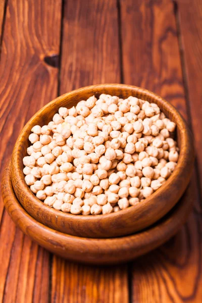 Chickpea in a wooden bowl — Stock Photo, Image