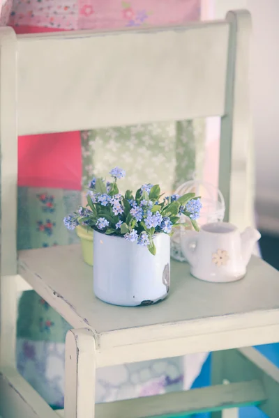 Forget-me-not in rustic cup — Stock Photo, Image