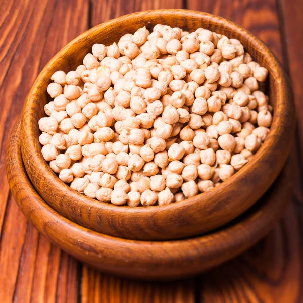 Chickpea in a wooden bowl — Stock Photo, Image