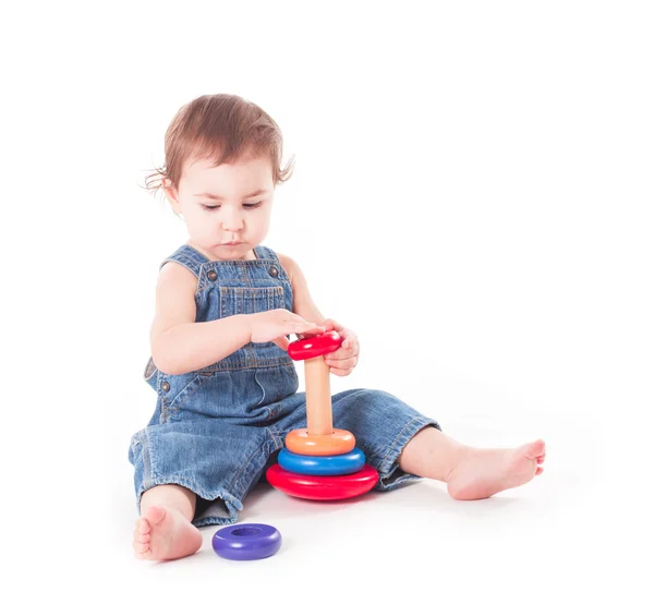 Kind met een stuk speelgoed — Stockfoto