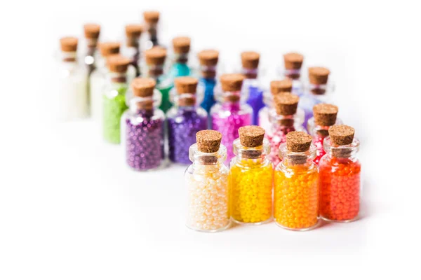 Colorful beads in the bottles — Stock Photo, Image