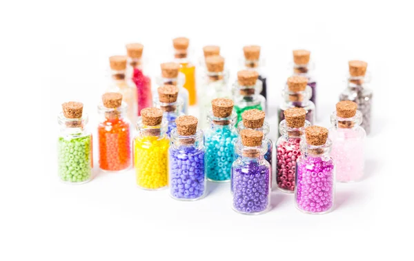 Colorful beads in the bottles — Stock Photo, Image