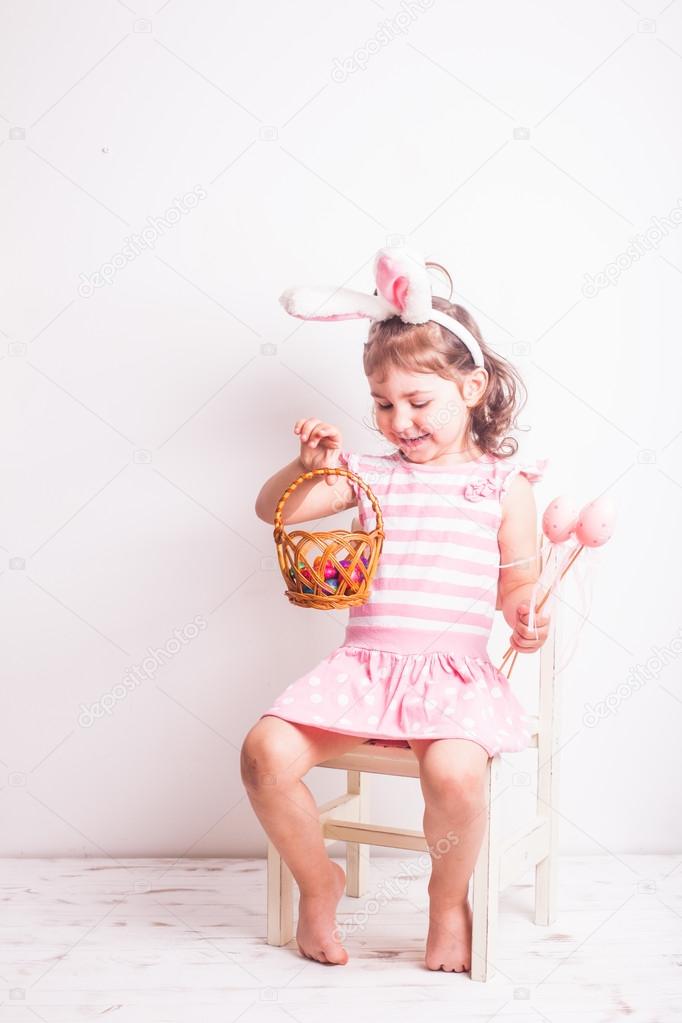 Girl eats a chocolate eggs