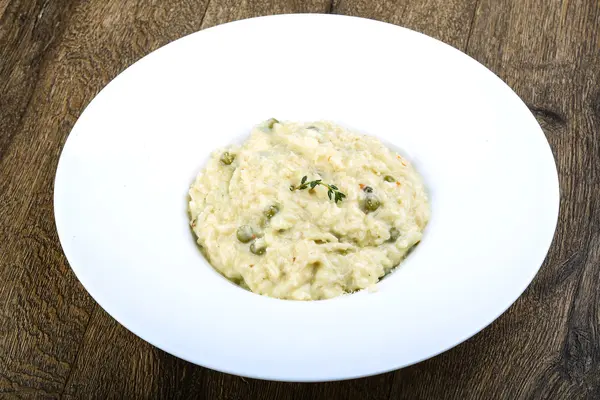 Risotto with cheese and green peas — Stock Photo, Image