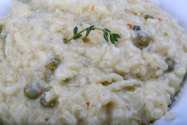 Risotto with cheese and green peas — Stock Photo, Image