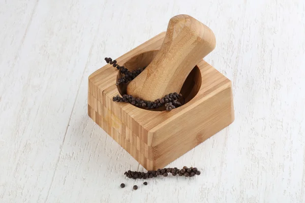 Wooden Mortar with black pepper — Stock Photo, Image