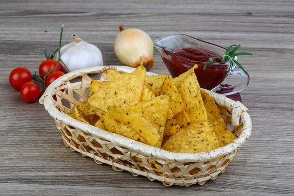 Nachos chips with tomato sauce — Stock Photo, Image