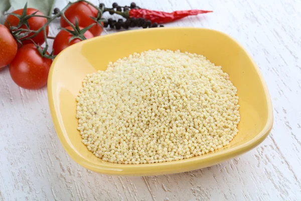 Raw millet in the bowl — Stock Photo, Image