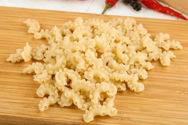 Raw macaroni heap — Stock Photo, Image