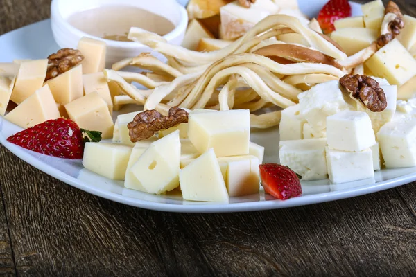 Cheese board with walnut — Stock Photo, Image