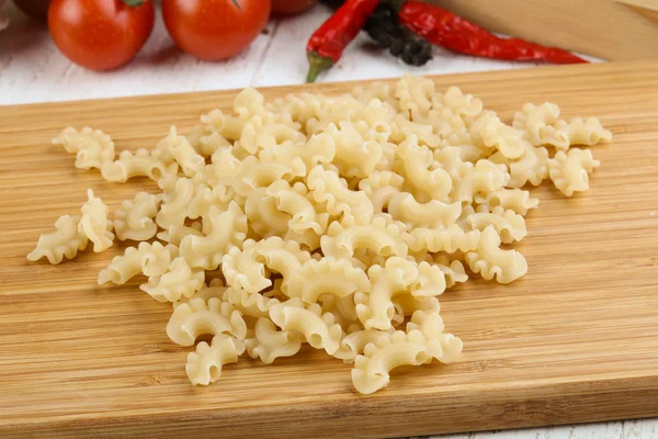 Raw macaroni heap — Stock Photo, Image