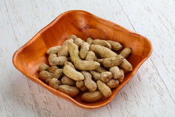 Unpeeled Peanuts in the bowl — Stock Photo, Image