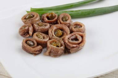 Delicious Anchovies with capers clipart