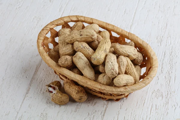 Unpeeled Peanuts in the bowl — Stock Photo, Image