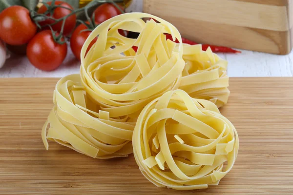 Raw fettuccine pasta — Stock Photo, Image