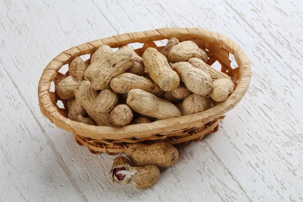 Unpeeled Peanuts in the bowl — Stock Photo, Image