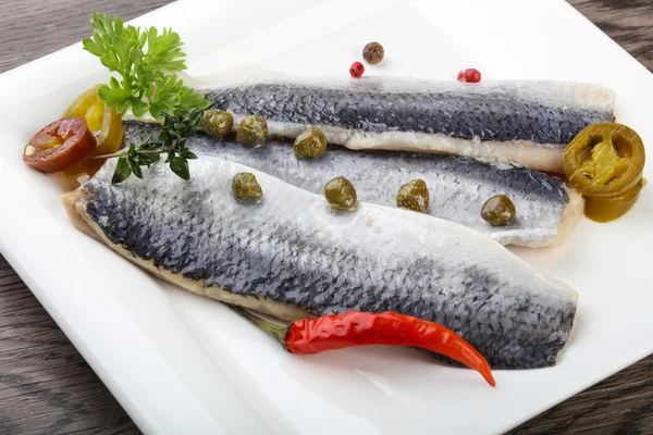 Herring fillet with capers — Stock Image Herring fillet with capers Royalty Free Stock Images