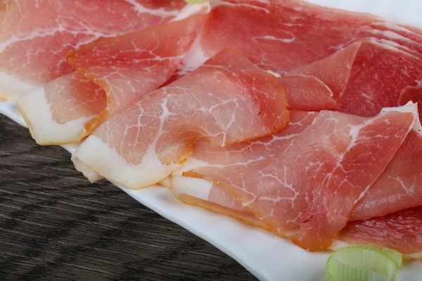 Spanyol Jamón a fa háttér — Stock Fotó