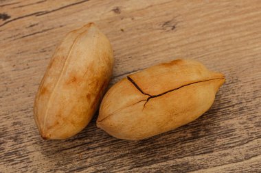 Ripe tasty Two whole pecan nuts