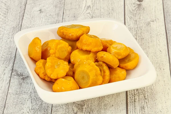Vegetarian food - Marinated yellow patisson in the bowl