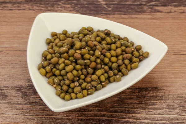 Vegetarian cuisine - dry green lentil for cooking