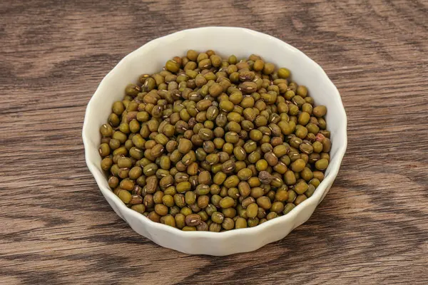 Vegetarian cuisine - dry green lentil for cooking