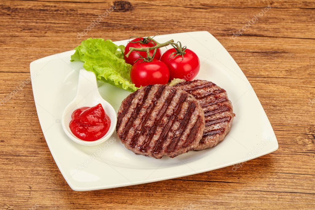 Grilled burger cutlet with tomato sauce