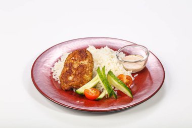 Tavuk pirzolası ve sebzeli pilav.