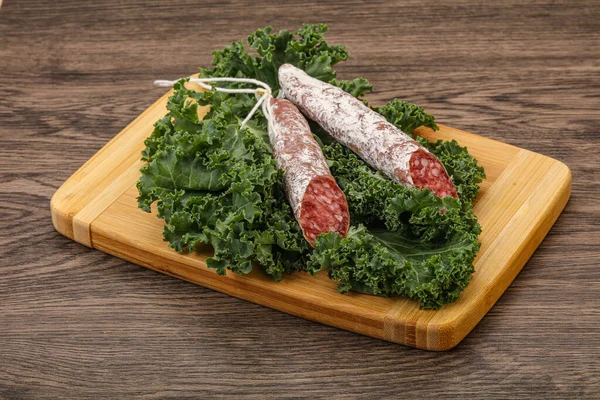 Spanish Fuet Sausage Salad Leaves Wooden Background — Stock Photo, Image