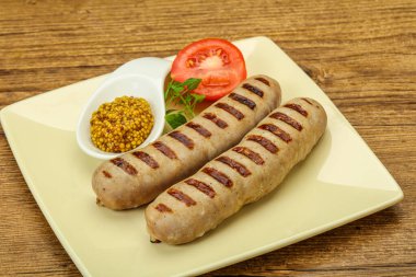 Hardal soslu ızgara domuz sosisi.