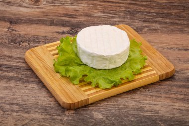 Delicous tradidional Brie round soft cheese clipart