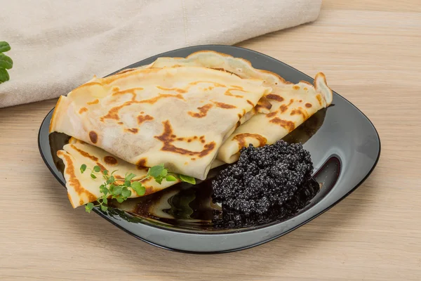 Pancakes with black caviar — Stock Photo, Image