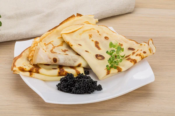 Pancakes with black caviar — Stock Photo, Image