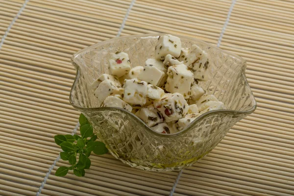 Cheese with spices and oil — Stock Photo, Image