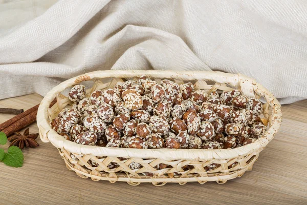 Peanut in honey with sesame seeds — Stock Photo, Image