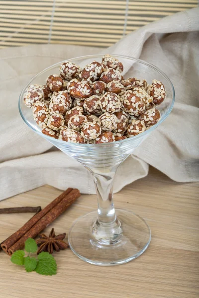 Peanut in honey with sesame seeds — Stock Photo, Image