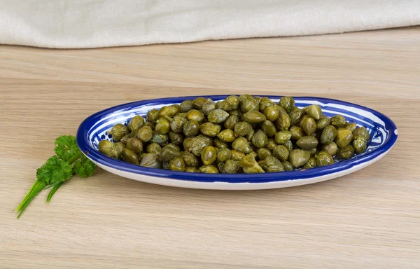 Capers in the bowl — Stock Photo, Image