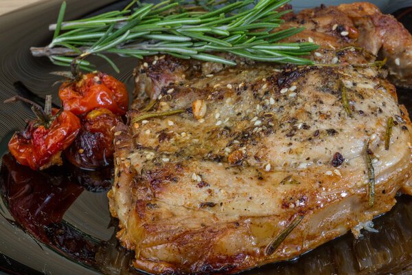 Roasted pork with rosemary and thyme spices